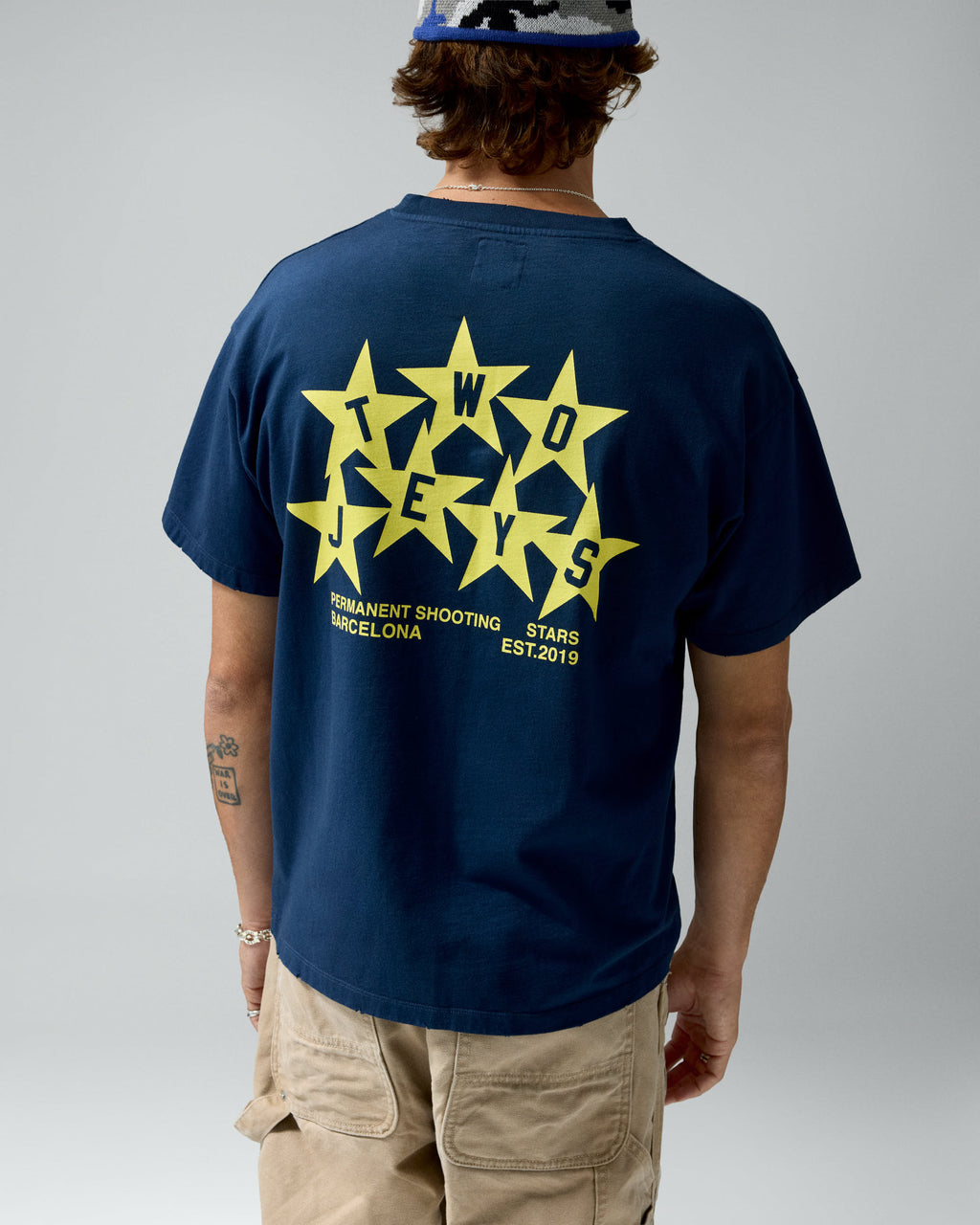 Permanent Shooting Stars Tee Navy – worn by model